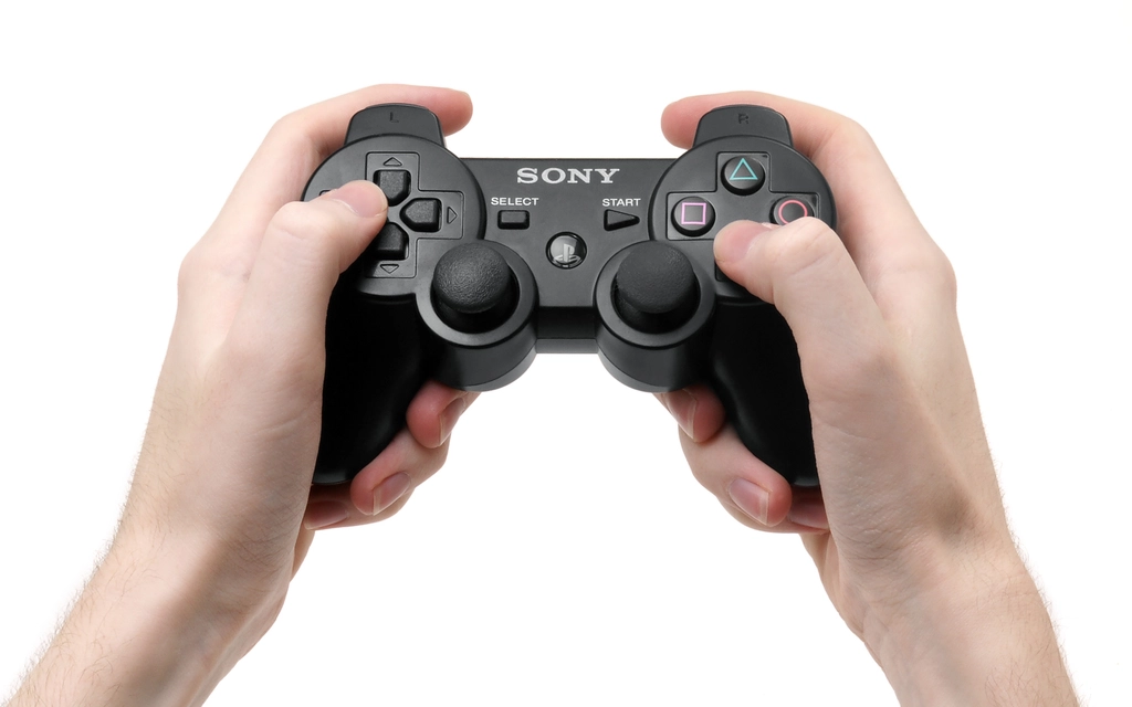 PlayStation DualShock 3 controller held in hand